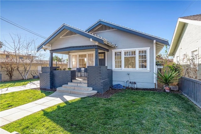 craftsman-style home featuring a front yard