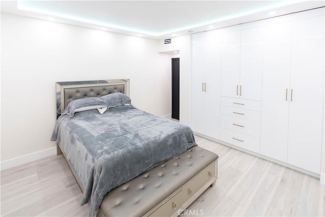 bedroom with light hardwood / wood-style flooring