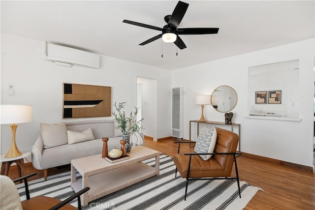 5536 Linden Ave, Long Beach, CA 90805 - living room featuring baseboards, a heating unit, a wall mounted AC, and ceiling fan