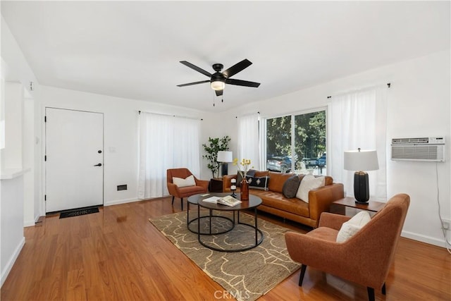 5536 Linden Ave, Long Beach, CA 90805 - living area featuring wood finished floors, baseboards, ceiling fan, and a wall mounted AC