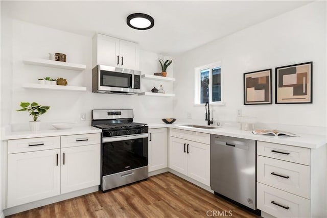 5536 Linden Ave, Long Beach, CA 90805 - kitchen featuring white cabinets, open shelves, a sink, light countertops, and stainless steel appliances