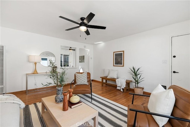 5536 Linden Ave, Long Beach, CA 90805 - living area featuring ceiling fan, wood finished floors, and a heating unit