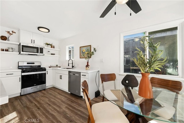 5536 Linden Ave, Long Beach, CA 90805 - kitchen with light countertops, open shelves, a sink, and stainless steel appliances