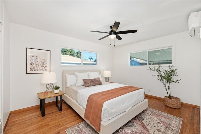 bedroom featuring ceiling fan and light wood-type flooring