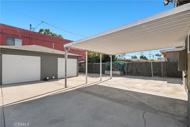 view of car parking featuring a garage