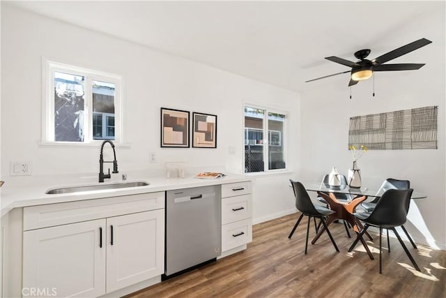 5536 Linden Ave, Long Beach, CA 90805 - kitchen featuring stainless steel dishwasher, a ceiling fan, wood finished floors, white cabinets, and a sink