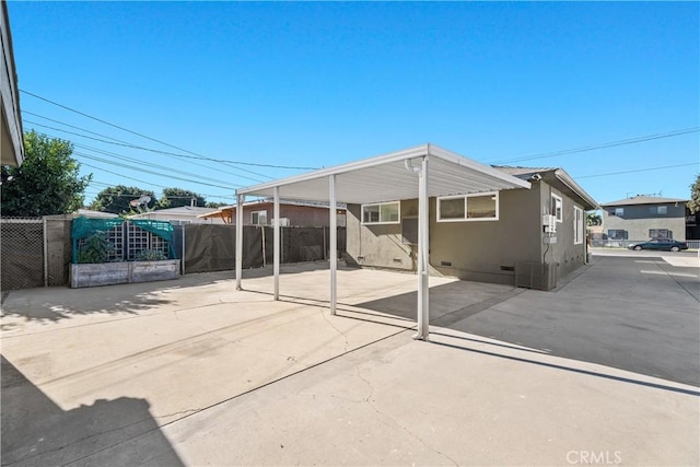 5536 Linden Ave, Long Beach, CA 90805 - view of patio featuring fence, a carport, and concrete driveway