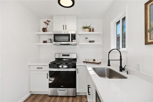 5536 Linden Ave, Long Beach, CA 90805 - kitchen featuring light countertops, open shelves, appliances with stainless steel finishes, and a sink