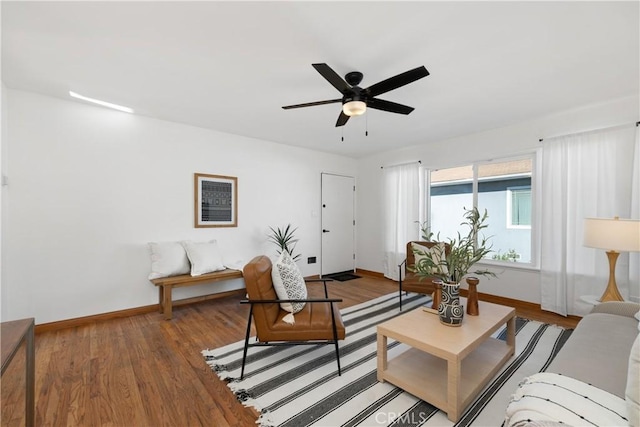 living room with ceiling fan and wood-type flooring