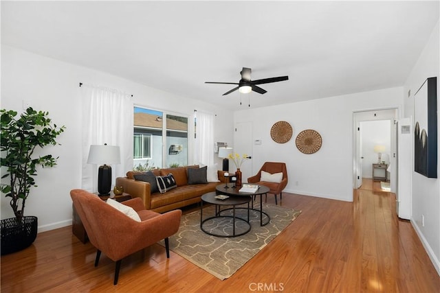 5536 Linden Ave, Long Beach, CA 90805 - living area with light wood-style floors, baseboards, and ceiling fan
