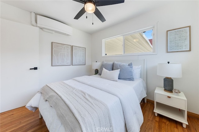 5536 Linden Ave, Long Beach, CA 90805 - bedroom with ceiling fan, wood finished floors, and a wall mounted air conditioner