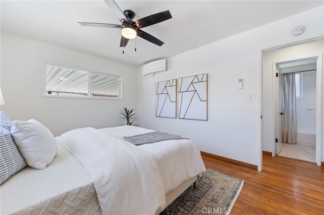 5536 Linden Ave, Long Beach, CA 90805 - bedroom with light wood-style floors, a ceiling fan, baseboards, and a wall unit AC