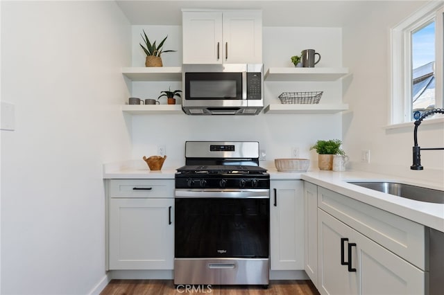 5536 Linden Ave, Long Beach, CA 90805 - kitchen featuring light countertops, open shelves, appliances with stainless steel finishes, and a sink