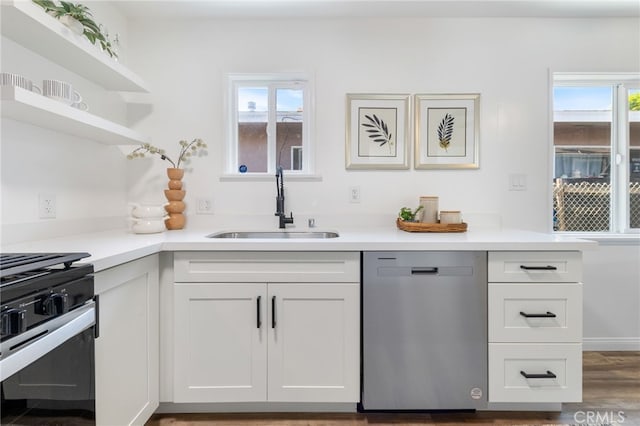 5536 Linden Ave, Long Beach, CA 90805 - kitchen with open shelves, light countertops, white cabinets, a sink, and appliances with stainless steel finishes
