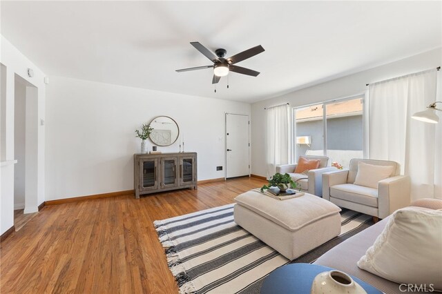 5536 Linden Ave, Long Beach, CA 90805 - living area featuring baseboards, a ceiling fan, and wood finished floors