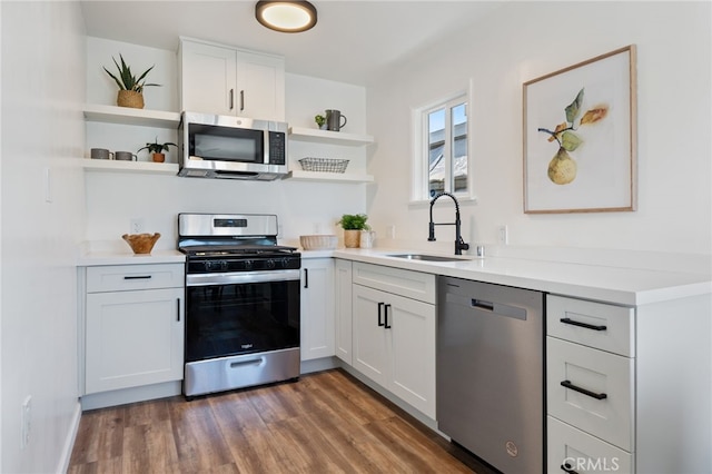 5536 Linden Ave, Long Beach, CA 90805 - kitchen featuring a sink, appliances with stainless steel finishes, open shelves, and white cabinetry
