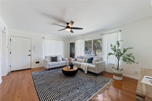 5536 Linden Ave, Long Beach, CA 90805 - living area featuring baseboards, ceiling fan, and light wood finished floors