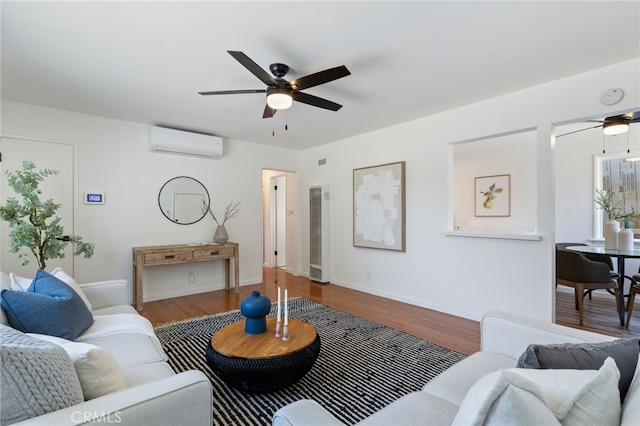 5536 Linden Ave, Long Beach, CA 90805 - living area featuring an AC wall unit, a ceiling fan, a heating unit, and wood finished floors