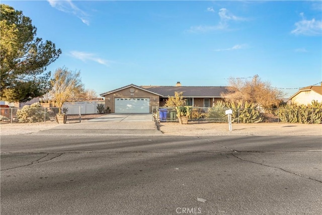 ranch-style home featuring a garage