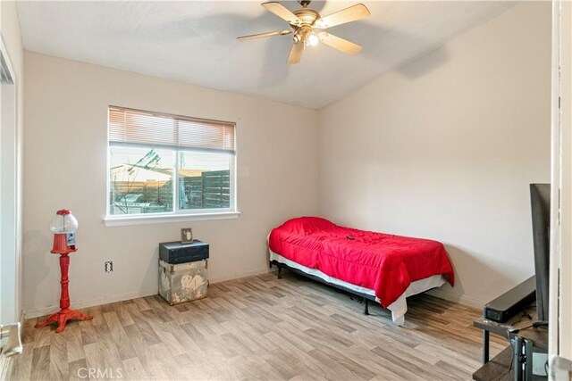 21246 Wren St, Apple Valley, CA 92308 - bedroom with vaulted ceiling, baseboards, light wood finished floors, and ceiling fan