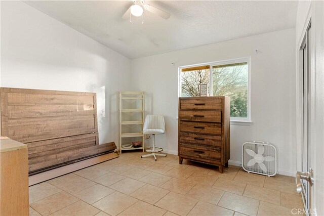 21246 Wren St, Apple Valley, CA 92308 - unfurnished room with baseboards, lofted ceiling, light tile patterned floors, baseboard heating, and a ceiling fan