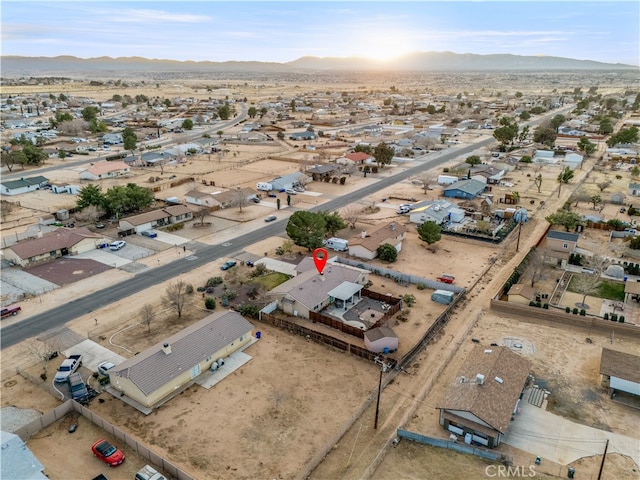 birds eye view of property featuring a mountain view