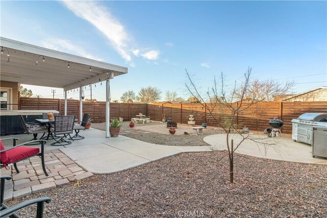 21246 Wren St, Apple Valley, CA 92308 - exterior space featuring a patio, outdoor dining area, and a fenced backyard