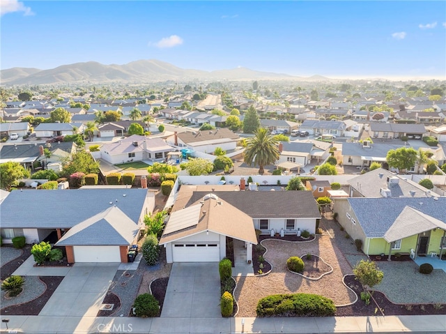 birds eye view of property with a mountain view