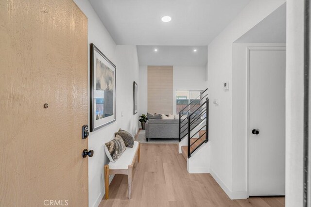 hall with light hardwood / wood-style flooring