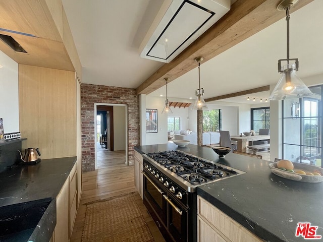 kitchen featuring hardwood / wood-style floors, double oven range, beamed ceiling, hanging light fixtures, and brick wall