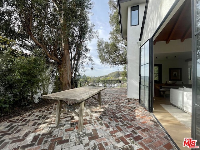 view of patio / terrace featuring a mountain view