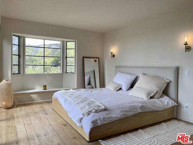 bedroom with light wood-type flooring