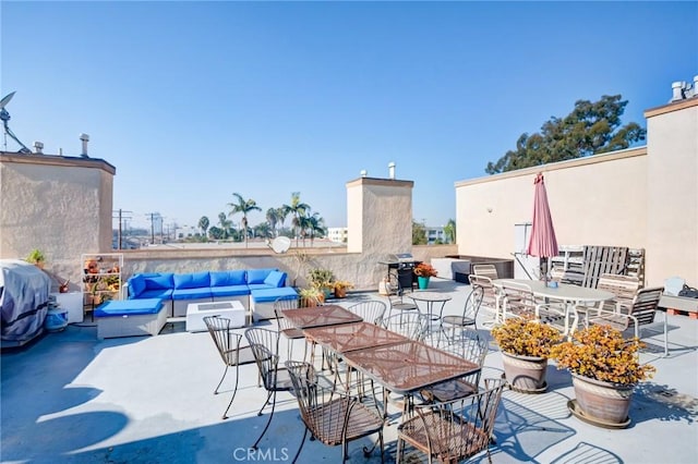 view of patio / terrace featuring an outdoor living space and area for grilling