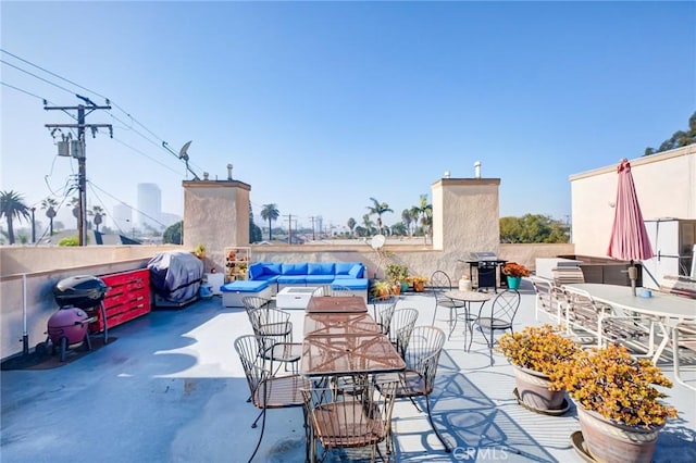 view of patio / terrace with an outdoor hangout area and grilling area