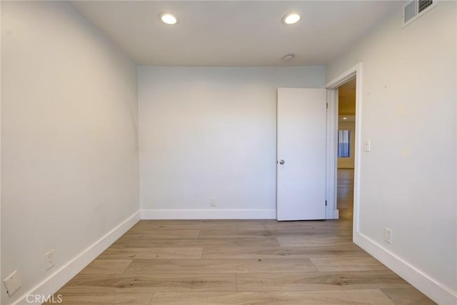 spare room featuring light hardwood / wood-style flooring