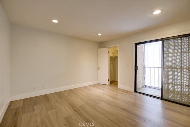 spare room featuring light hardwood / wood-style flooring