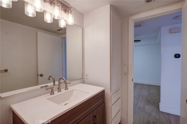 bathroom featuring hardwood / wood-style floors and vanity