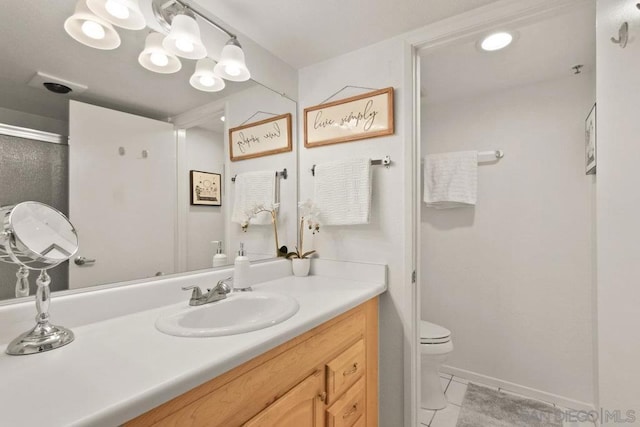 bathroom featuring toilet, tile patterned floors, an enclosed shower, and vanity