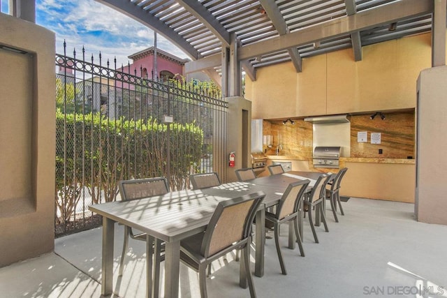 view of patio featuring a pergola and area for grilling