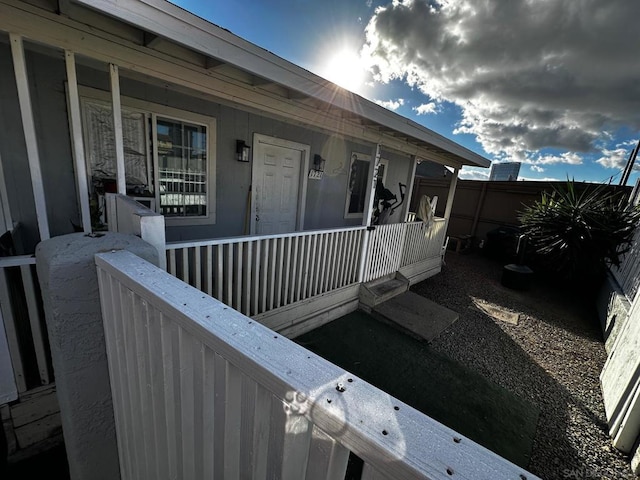 property entrance with covered porch