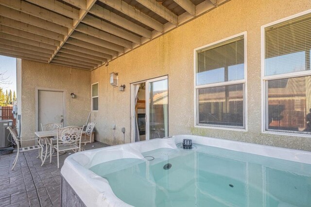 view of patio with a hot tub