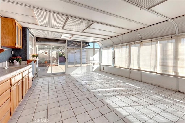 unfurnished sunroom with sink