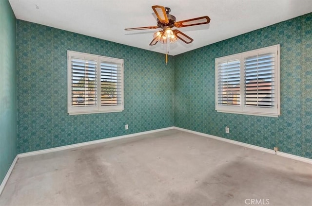 spare room with ceiling fan