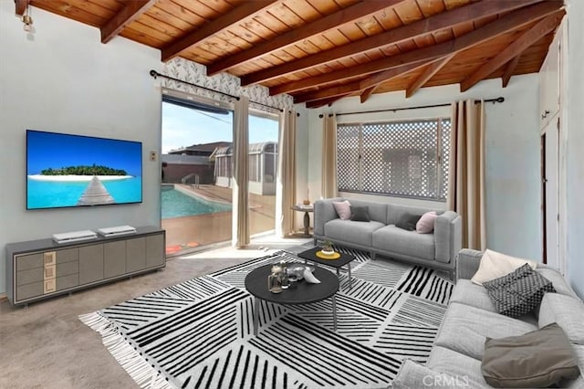 sunroom / solarium featuring beam ceiling and wooden ceiling