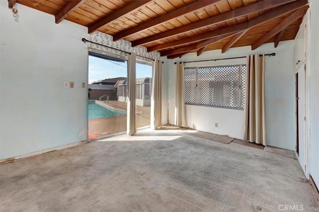 interior space featuring beam ceiling and wooden ceiling