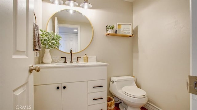 bathroom featuring toilet and vanity