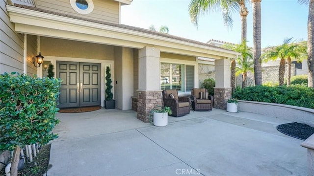 entrance to property featuring a patio