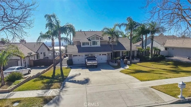 view of front facade with a garage and a front yard