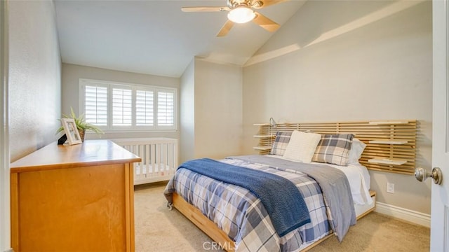 carpeted bedroom with ceiling fan, lofted ceiling, and radiator heating unit