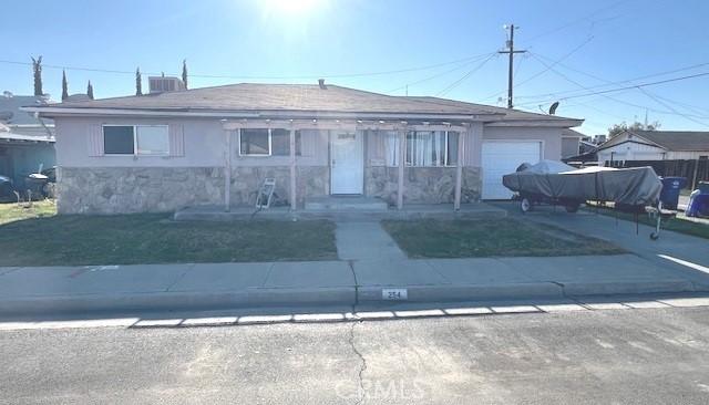 view of front of home with a garage and a front yard